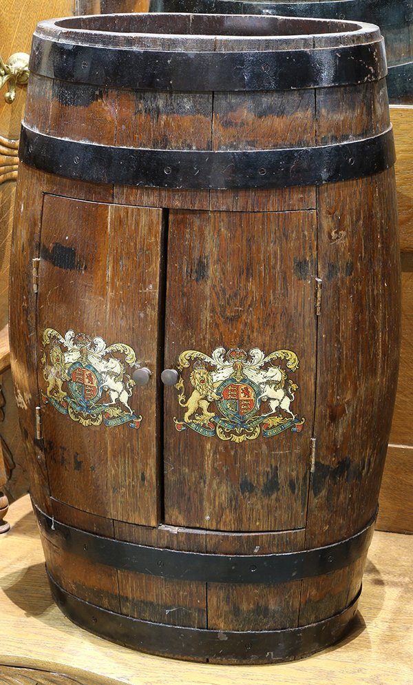 Oak barrel, the oval form having stave construction: Oak barrel, the oval form having stave construction with two doors, each with armorial seals, 24"h x 13"w. Provenance: Property from the Christian de Guigne' IV Estate, Hillsborough, CA.