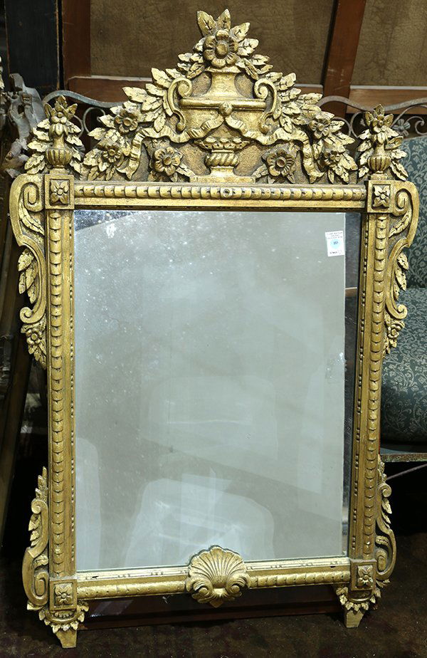 Louis XV giltwood carved wall mirror, having an urn and (1 of 1)