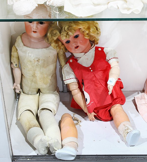 (lot of 2) German J: (lot of 2) German J.D. Kestner bisque shoulder plate doll with hand-painted facial features, brown sleep eyes, and an open mouth with upper teeth, attached to a jointed kid body with bisque hands, 30"
