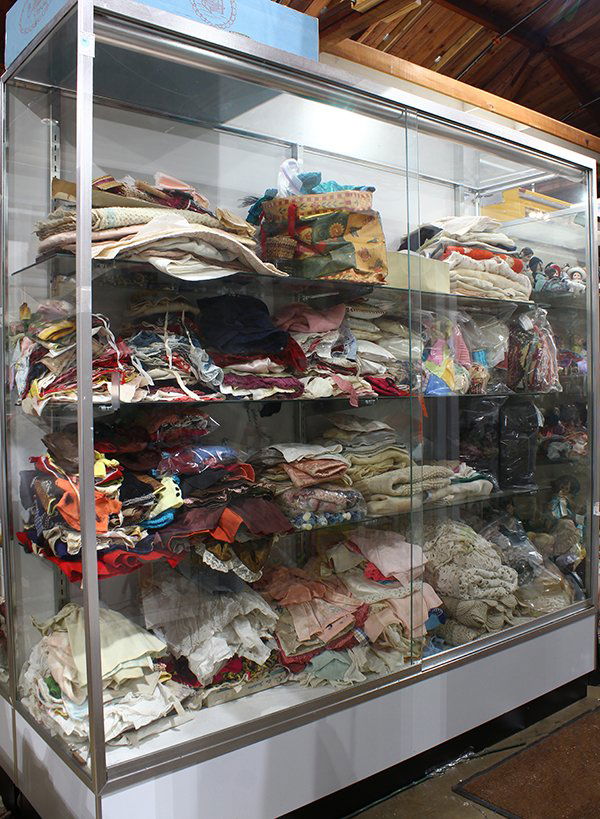 Four shelves of doll clothes and hats, notions, (1 of 1)