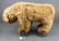 Vintage Steiff fur teddy bear mounted to iron wheels,