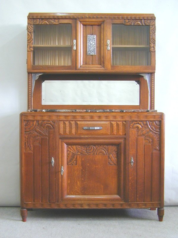 Art Deco oak dining room suite: French Art Deco oak dining room suite including a marble top buffet, 82"h x 55" x 17"; marble top sideboard, 55"h x 45" x 17"; table with one leaf, 60" x 41"; eight chairs and a mirror, 47" x 30", cir