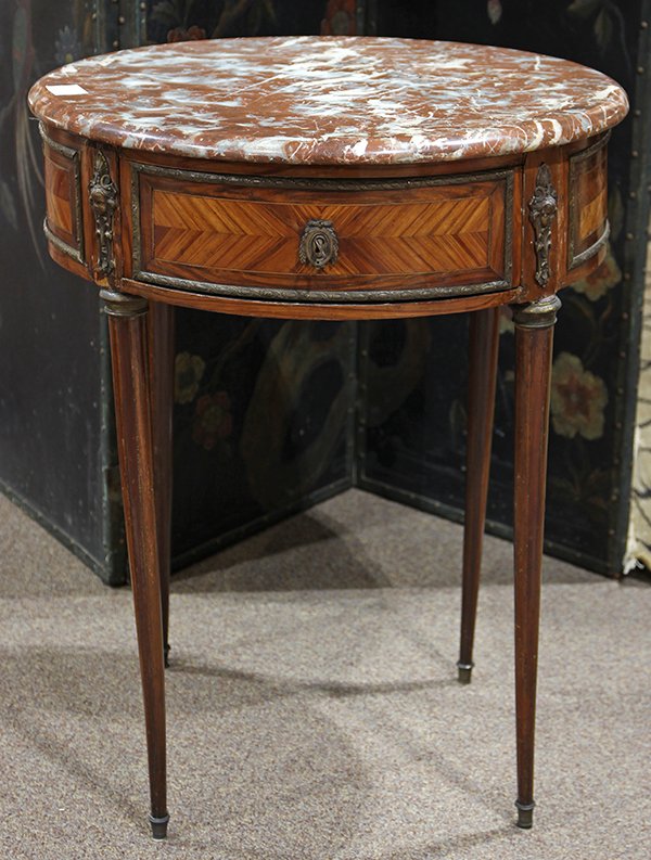 Louis XVI style gueridon, circa 1890, having a circular: Louis XVI style gueridon, circa 1890, having a circular marble top, above oromulu mounts and rising on tapered legs, 29"h x 23"dia. Provenance: Property from the Christian de Guigne' IV Estate, Hillsb