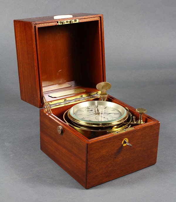 Thomas Mercer chronometer, housed in a fitted box,: Thomas Mercer chronometer, housed in a fitted box, opening to a Roman numeral silvered dial, marked Thomas Mercer, having an up/down indicator, seconds dial, blued steel hands, etc., and bearing a pla