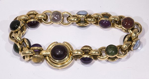 Multi-gem and 18k yellow gold bracelet: Multi-gem and 18k yellow gold bracelet composed of round cabochons of green and pink tourmaline, amethyst, citrine and synthetic spinel, bezel set in a fancy double sided cable-link bracelet, complete