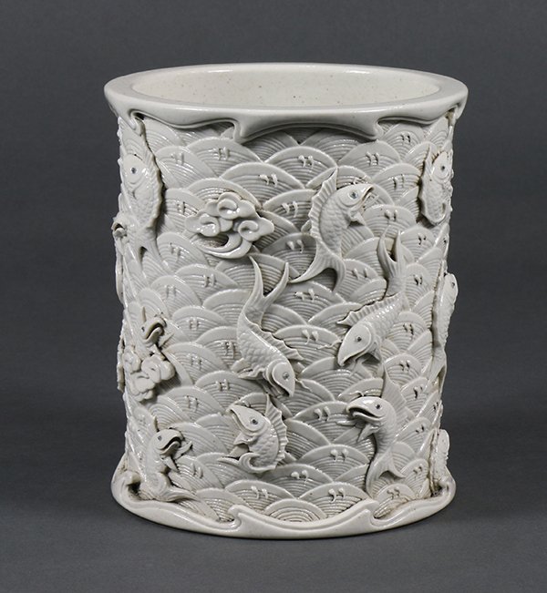 Chinese White Brush Pot, Fish: Chinese glazed white bisque brush pot, with applied fish jumping out of the sea molded in relief, the recessed base marked 'Wang Bingrong zuo', 5.75"h