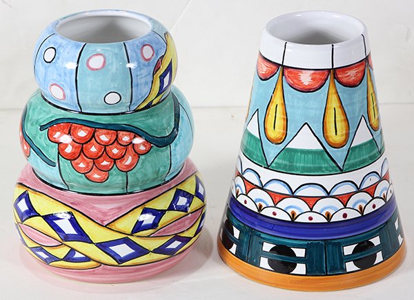 John Okulick (American, born 1947), ceramic vases: (lot of 2) John Okulick (American, born 1947), ceramic vases each having polychrome geometric decoration, one having a gourd form, the other a cylindrical form, each signed on underside, largest: 9.5"