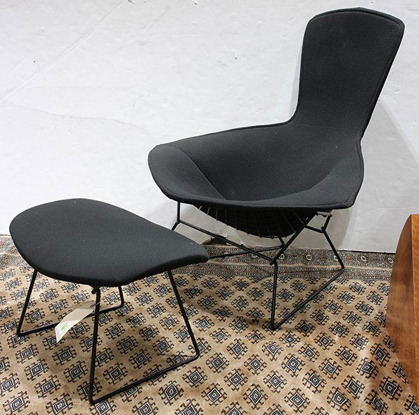 Harry Bertoia for Knoll "Bird" chair and ottoman: Harry Bertoia for Knoll "Bird" chair and ottoman, having black upholstery above a black wire seat, chair: 38"h x 38"w x 30"d, ottoman: 14"h