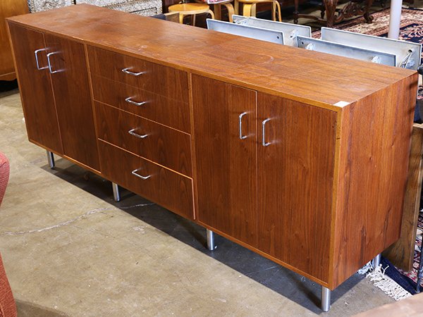 Mid-Century Modern teak credenza: Mid-Century Modern teak credenza, having a recangular top above the four drawer case, and rising on tubular chrome legs, 32"h x 78"w x 18.5"d