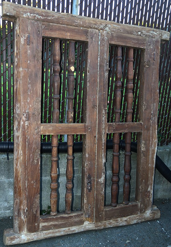 Moroccan window frames with inserts: Moroccan window frames with inserts, having hand hewn frames supporting the baluster turned inserts, overall 67"h x 54"w