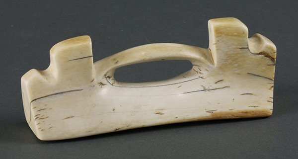 Inuit (Eskimo) or early Arctic handle, implement, or: Inuit (Eskimo) or early Arctic handle, implement, or tool, 19th Century or earlier, fashioned from walrus tusk, probably Bering Sea area, Alaska, 5". Provenance: Retired Southern California Art Profes