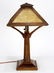 Arts and Crafts slag glass and oak table lamp, having a - 3