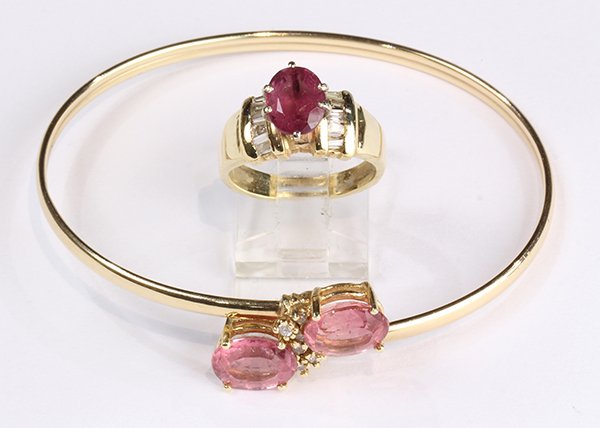 Pink tourmaline, diamond and 14k yellow gold jewelry: Pink tourmaline, diamond and 14k yellow gold jewelry suite comprised of one by-pass motif bangle, featuring (2) oval cut tourmalines weighing a total of approximately 5.50 cts., accented by (6) full c