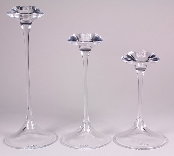(Lot of 3) Graduated Swedish Kosta Boda glass: (Lot of 3) Graduated Swedish Kosta Boda glass candlesticks, 20th Century, designed by Kjell Engman in the "Fanfare" design, retaining the original boxes, largest: 10.5"h