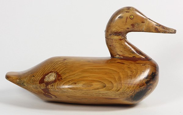 Carved wood duck decoy, 20th century, with yellow glass (1 of 3)