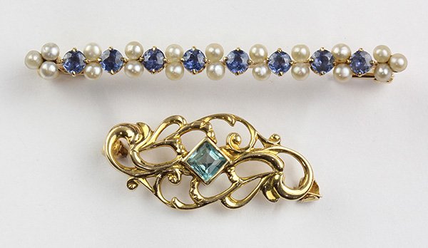 Collection of gem and yellow gold pins: Collection of gem and yellow gold pins including an Edwardian sapphire, seed pearl and 14k yellow gold bar pin, 1 3/4", together with a Victorian doublet and 10k yellow gold scroll work pin, 1", gross