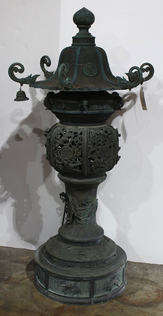 Japanese Large Patinated Bronze Toro Garden Lantern: Japanese large patinated bronze toro (garden lantern), Meiji period, roof with five dragon heads to hang bells and Tokugawa clan crests, pierced work in the middle section with birds and Tokugawa clan