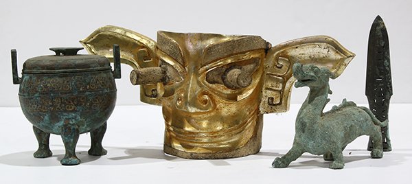 Chinese Archaistic Bronze Items: (lot of 9) Chinese archaistic bronze/metal items, including weapons, basin, wine vessels, animal sculptures and Sanxingdui style mask largest: 20.5"h. Provenance: Retired Southern California Professor