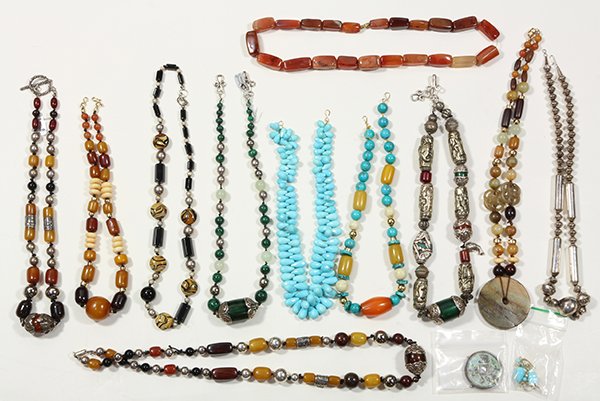 Collection of multi stone, plastic, silver and metal: Collection of multi stone, plastic, silver and metal jewelry including one rectangular carnelian bead, and metal necklace; turquoise briolette bead, and 14k yellow gold 18" necklace with matching pair