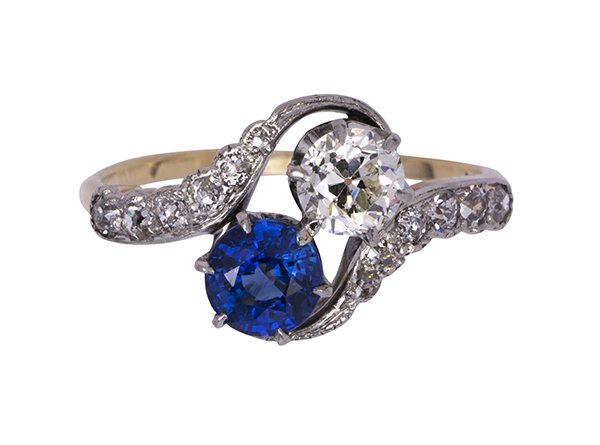 Edwardian sapphire, diamond, platinum and 14k yellow: Edwardian sapphire, diamond, platinum and 14k yellow gold ring featuring one round cut sapphire weighing approximately 0.65 ct., and one old European cut diamond weighing approximately 0.50 ct., accen