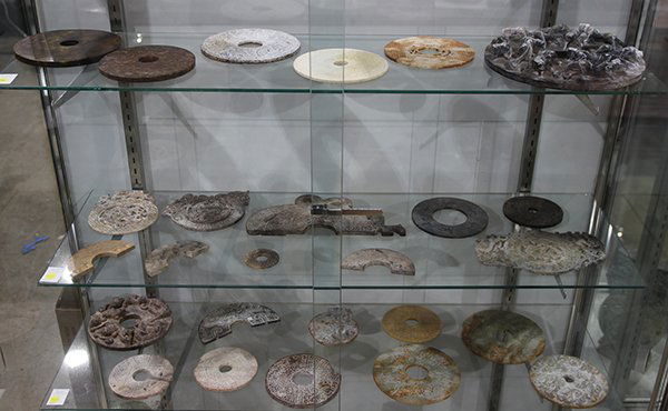 Three Shelves of Chinese Archaistic Hardstone Discs (1 of 1)