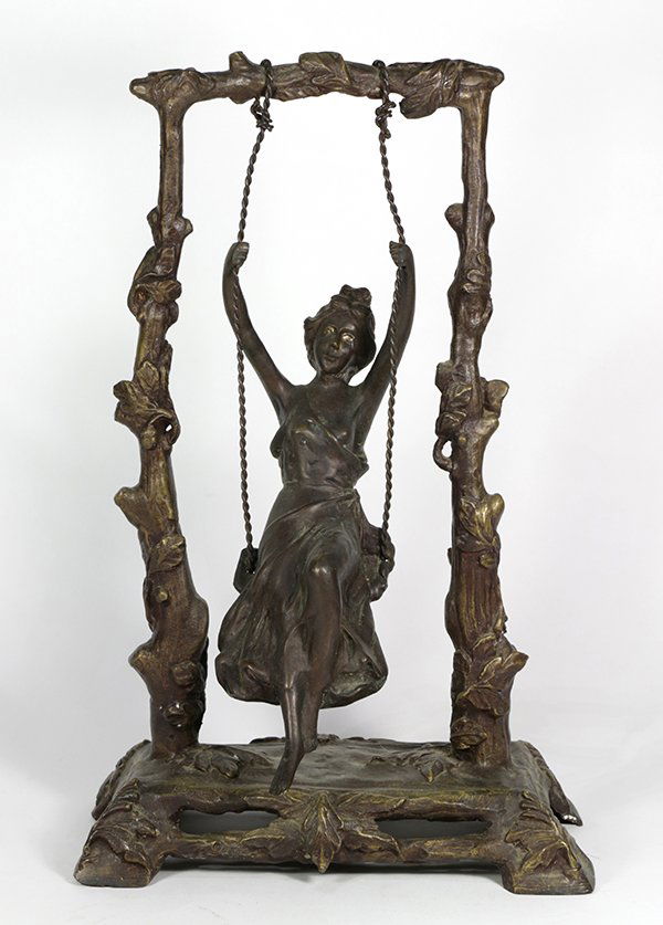 Patinated metal figural sculpture, depicting a lady on (1 of 2)