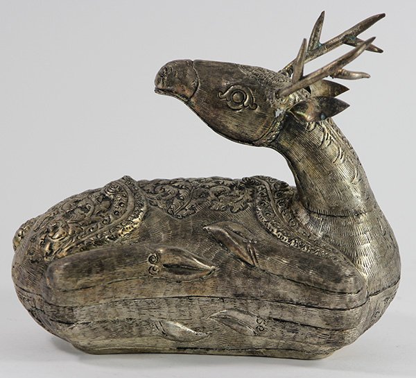 Indo-Persian style figural lidded box, in the form of a: Indo-Persian style figural lidded box, in the form of a reclining deer, having ornate repousse floral and geometric patterning throughout, 6.5"h x 7.5"w x 4.5"d