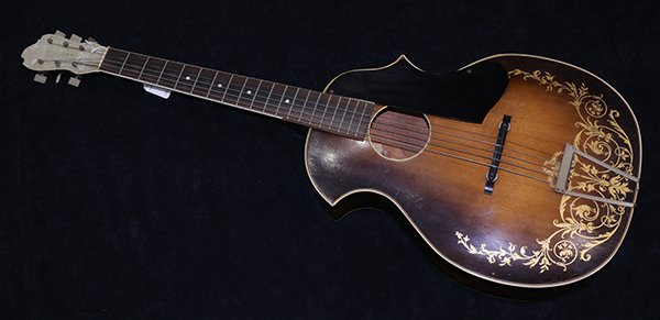 Kay Kraft Musical guitar, circa 1935, accented with: Kay Kraft Musical guitar, circa 1935, accented with Venetian style gilt scrollwork, 40"h x 14.5"w x 5.5"d