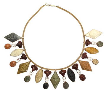 Rare Carlo Giuliano Archeological Revival, lava, jasper: Rare Carlo Giuliano Archeological Revival, lava, jasper and 18k yellow gold bib necklace, 19th century composed of various colored finely carved lava cameo's depicting classical Greek mythical faces,