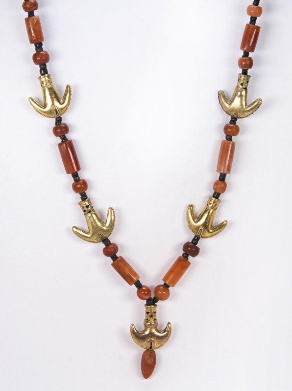 Pre-Columbian carnelian and tumbaga gold bead necklace: Pre-Columbian carnelian and tumbaga gold bead necklace featuring five tumbaga gold whale tail beads measuring approximately 27 x 26 mm, interspaced by barrel and disc shaped carnelian beads, further i