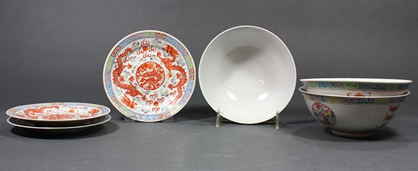 Chinese Dragon Bowls and Saucers: (lot of 6) Chinese enameled porcelain bowls and saucers, consisting of three bowls with dragon roundels, bases with apocryphal Qianlong marks; together with three saucers with meandering dragons, base