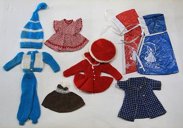 (Lot of approx.40) Miniature doll clothes, many crochet: (Lot of approx.40) Miniature doll clothes, many crochet and knitted examples, including dresses, rompers, pants, hats, vests, and other accessories, Property from the collection of Trotter’s Antique
