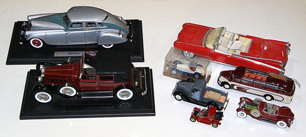 (Lot of 8) Toy model cars, including a red Eldorado (1 of 1)