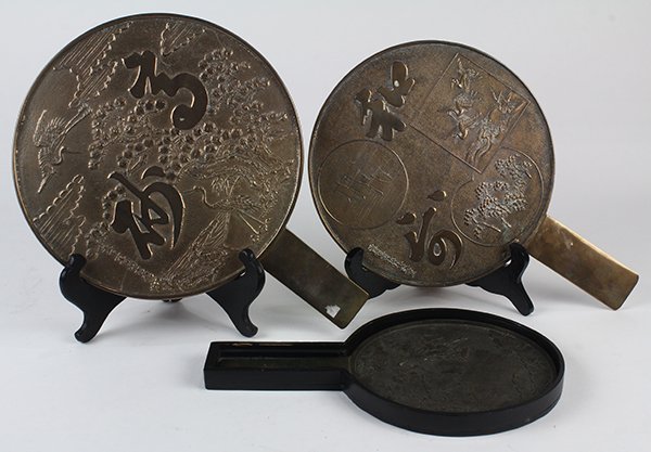 Japanese Mirrors, Edo period: (lot of 3) Japanese handheld mirrors, Edo period, one with wooden cover, each with signature, including 'Shunzan Yoshinobu', largest: approx. 9"dia + handle (3.5")