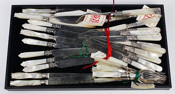 (lot of 30) American and English mother of pearl: (lot of 30) American and English mother of pearl handled knives, forks, spreader, and cheese scoop, some with sterling ferrules, largest: 10.25"l