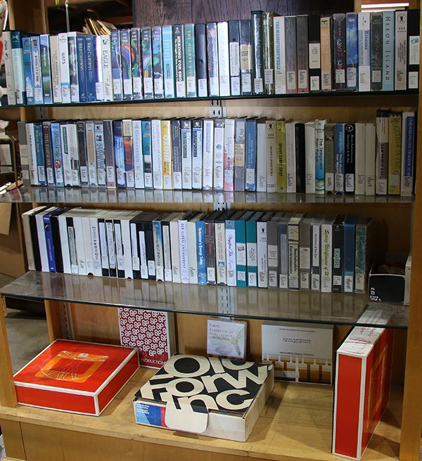 (Lot of approx: (lot of approx. 125) Four shelves of mostly VHS tapes, relating to Natural History including "Oceans for the Future", "Biodiversity for Forests and Farms", "When the Bay Area Quakes", "The Temperate R
