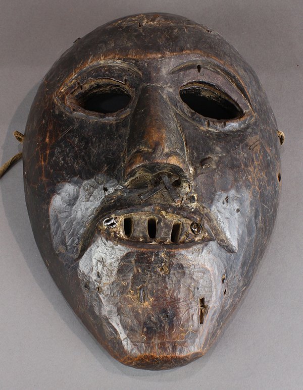Himalayan mask, Nepal, probably 19th century or: Himalayan mask, Nepal, probably 19th century or earlier, glossy patina of much use on back inside, a slightly largish example, three open spaces in mouth indicate teeth, 11"h. Provenance: The Collecti