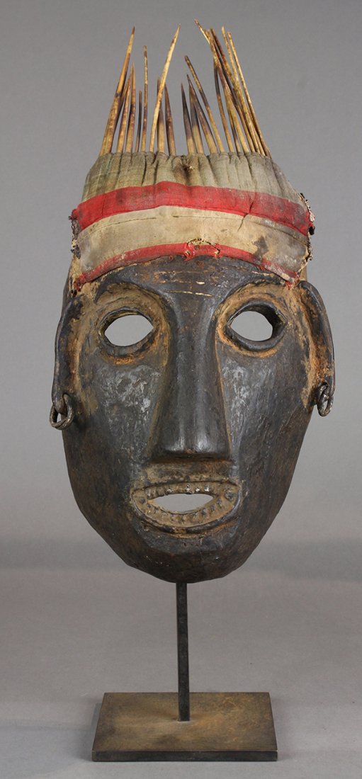 Himalayan mask, Nepal, 20th century, and of uncertain: Himalayan mask, Nepal, 20th century, and of uncertain age or use, even patina with smokiness or glossiness, well carved, slight incising on forehead, some metal as teeth, long ears with metal earrings