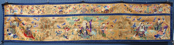 Chinese Daoist Textile Hanging: Chinese embroidered textile hanging, gilt couched with the characters 'sheng hou' and 'sheng ren' amid Daoist Immortals and centered with Shoulao on an orange ground (possibly a fragment), 98.5"w x 23
