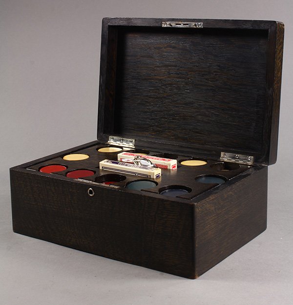 Poker set, the wenge wood box with a monogrammed lid: Poker set, the wenge wood box with a monogrammed lid opening to a removable fitted interior having pigeon holes for red, white and blue chips and two decks of cards, 5"h x 12"w x 8"d