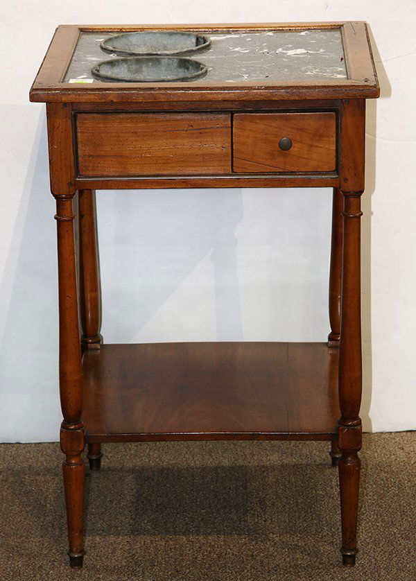 Edwardian jardiniere: Edwardian jardiniere, having a variegated marble top with inset tin planters above a single drawer case, rising on turned legs conjoined by a single tiered shelf, 27.5"h x 18"w x 18"d