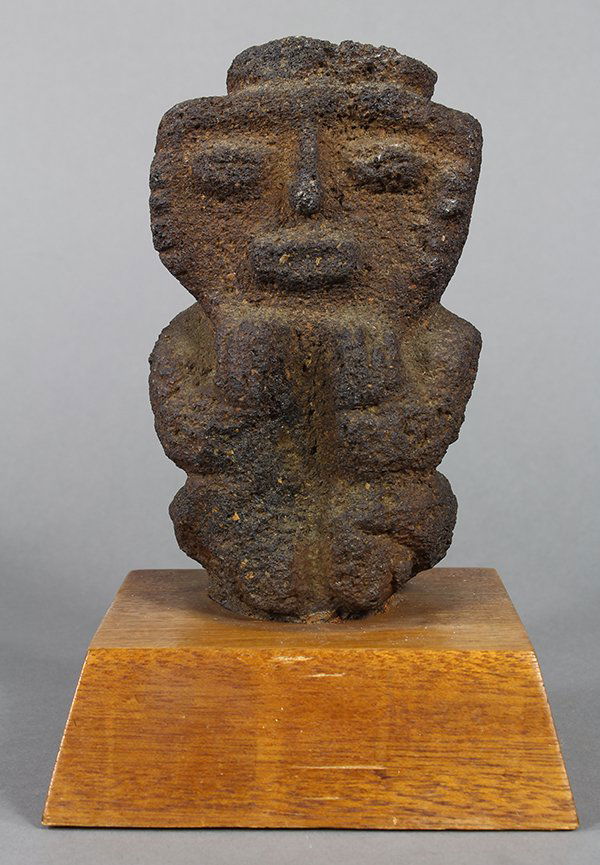Pre-Columbian style volcanic stone figure in a hunkered (1 of 2)