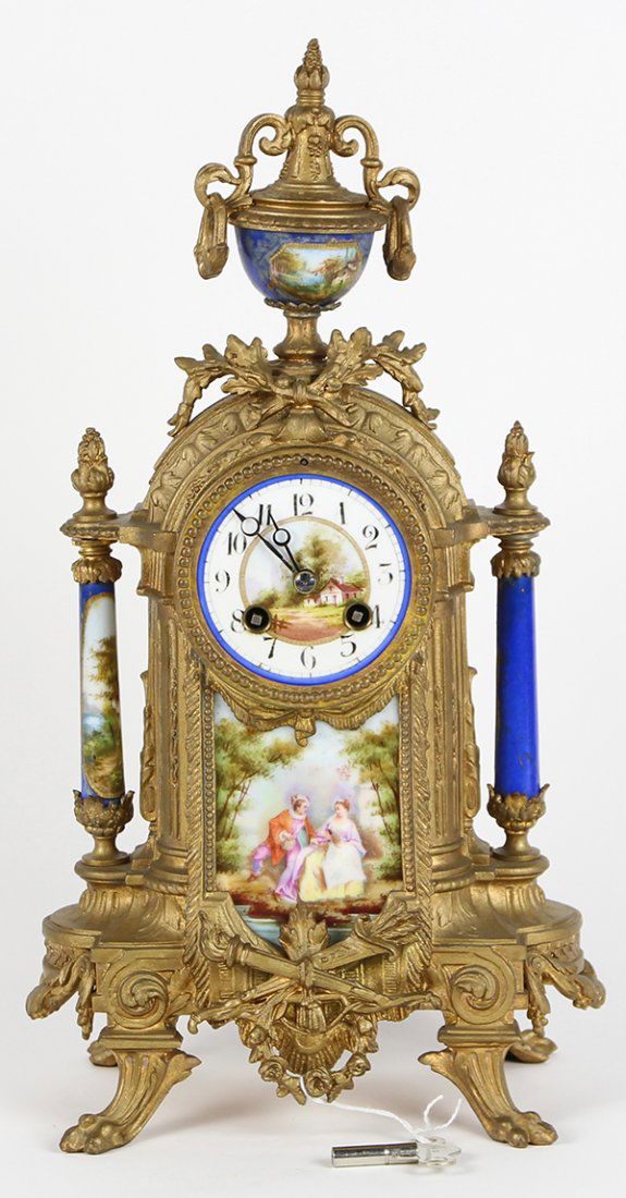 French Neo-Classical style mantle clock fronted by an (1 of 3)