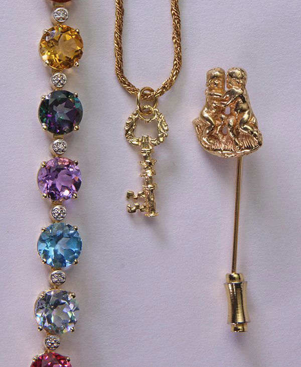 (Lot of 2) Synthetic treated colored stone, and 14k: (Lot of 2) Synthetic treated colored stone, and 14k yellow gold jewelry including one 14k yellow gold key pendant with 14k yellow gold, 14", 1.6 mm woven link chain; one 14k yellow gold stick pin with