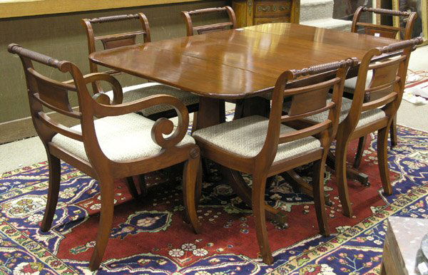 Cherry Duncan Phyfe Style Dining Suite: Cherry Duncan Phyfe style dining suite consisting of an extension drop-leaf table with three pedestal legs, 61''w x 42''d x 29.5''h open, and two 13.5''w leaves; five Klismos side chairs with saber le