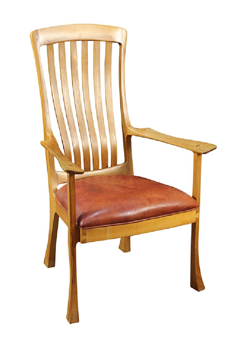 American Studio armchair executed by Robert Erickson: American Studio armchair executed by Robert Erickson, designed and made in 1982, having a contoured back continuing to the outswept arms, and rising on reverse tapered legs, 42"h x 27"w
