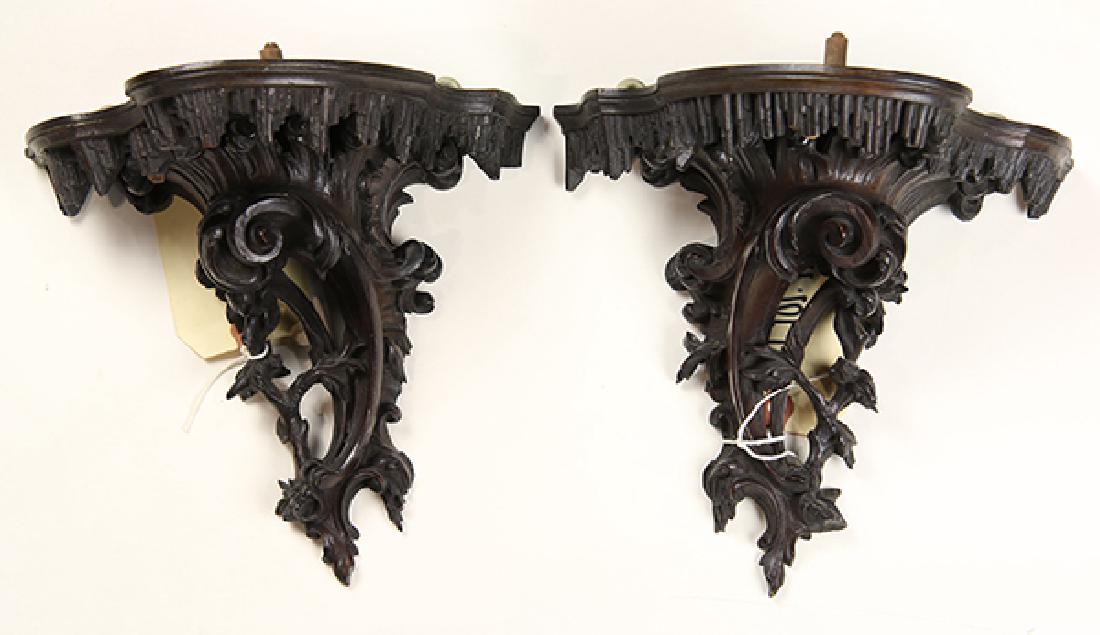 Pair of English Rococo style wall brackets, having: Pair of English Rococo style wall brackets, having rocaille supports surmounting the shaped top, one with Irwin Untermyer Collection label, 9"h x 9"w. Property of the Metropolitan Museum of Art, Sold