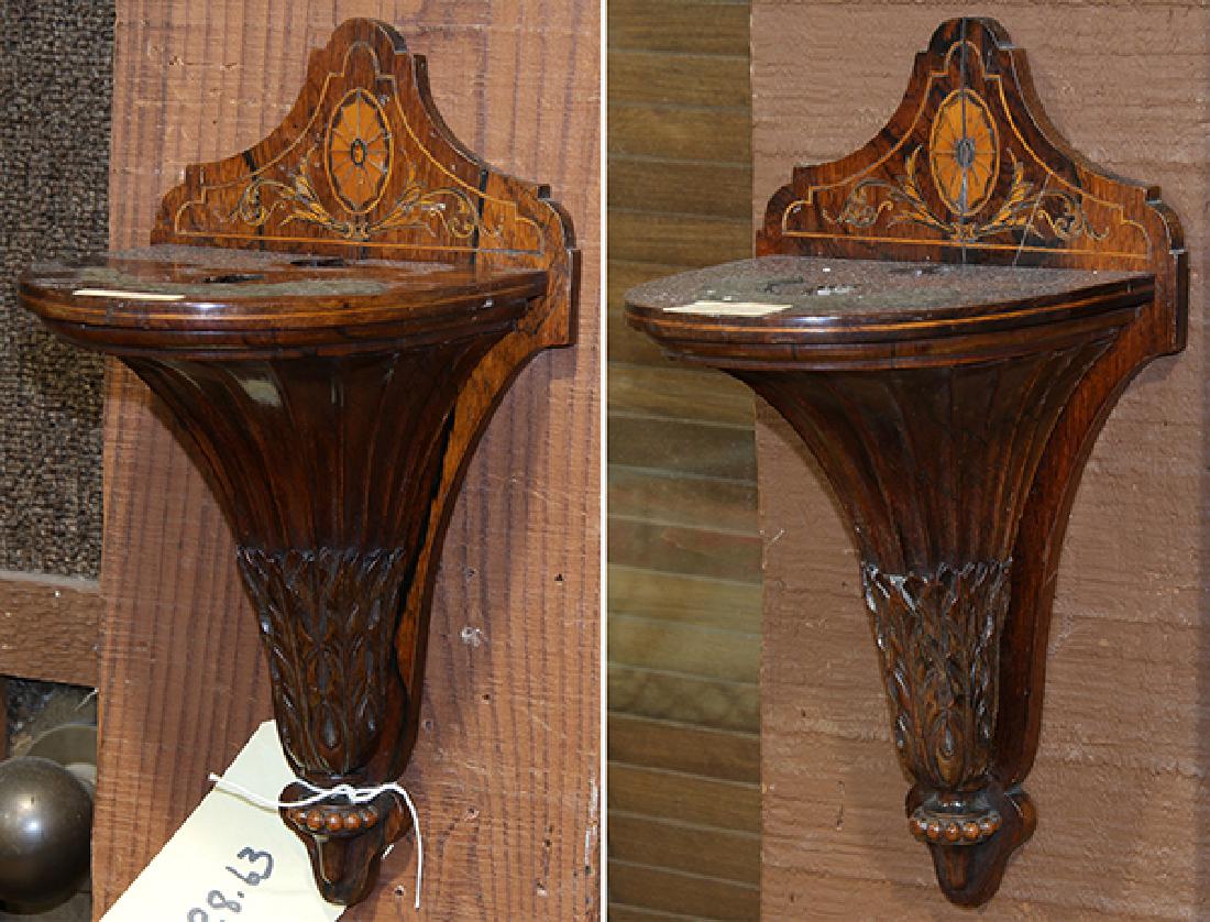 (lot of 2) English inlaid rosewood wall brackets, 19th: (lot of 2) English inlaid rosewood wall brackets, 19th century, each having a shaped back centered with a spherical medallion, above foliate accents, and rising on a shaped support, 11"h. Property of 