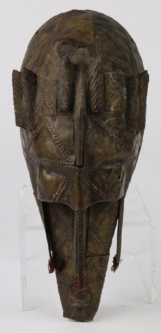 Mali hardwood mask of fine-grained old hard wood, circa: Mali hardwood mask of fine-grained old hard wood, circa 1960, covered in brass sheeting typical to the Marka people of Mali, with an ascetic that influenced the cubist artists in Paris, 13.5"h