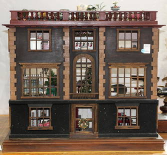 Georgian style doll house with furniture, three story: Georgian style doll house with furniture, three story structure with roof top deck, front parlor, and large entry, interiors with wall paper, together with interior furniture and a box of associated f